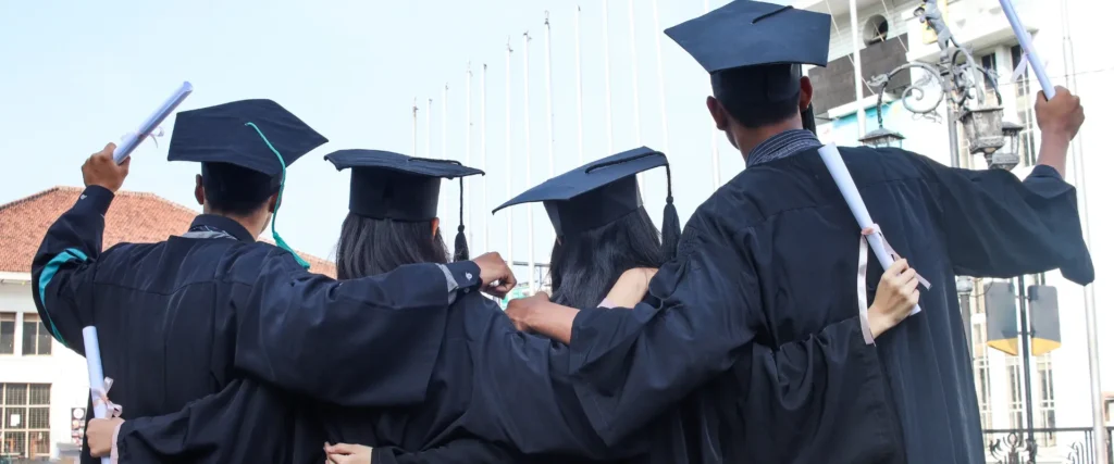 Four law school graduates representing law school bar exam pass rates